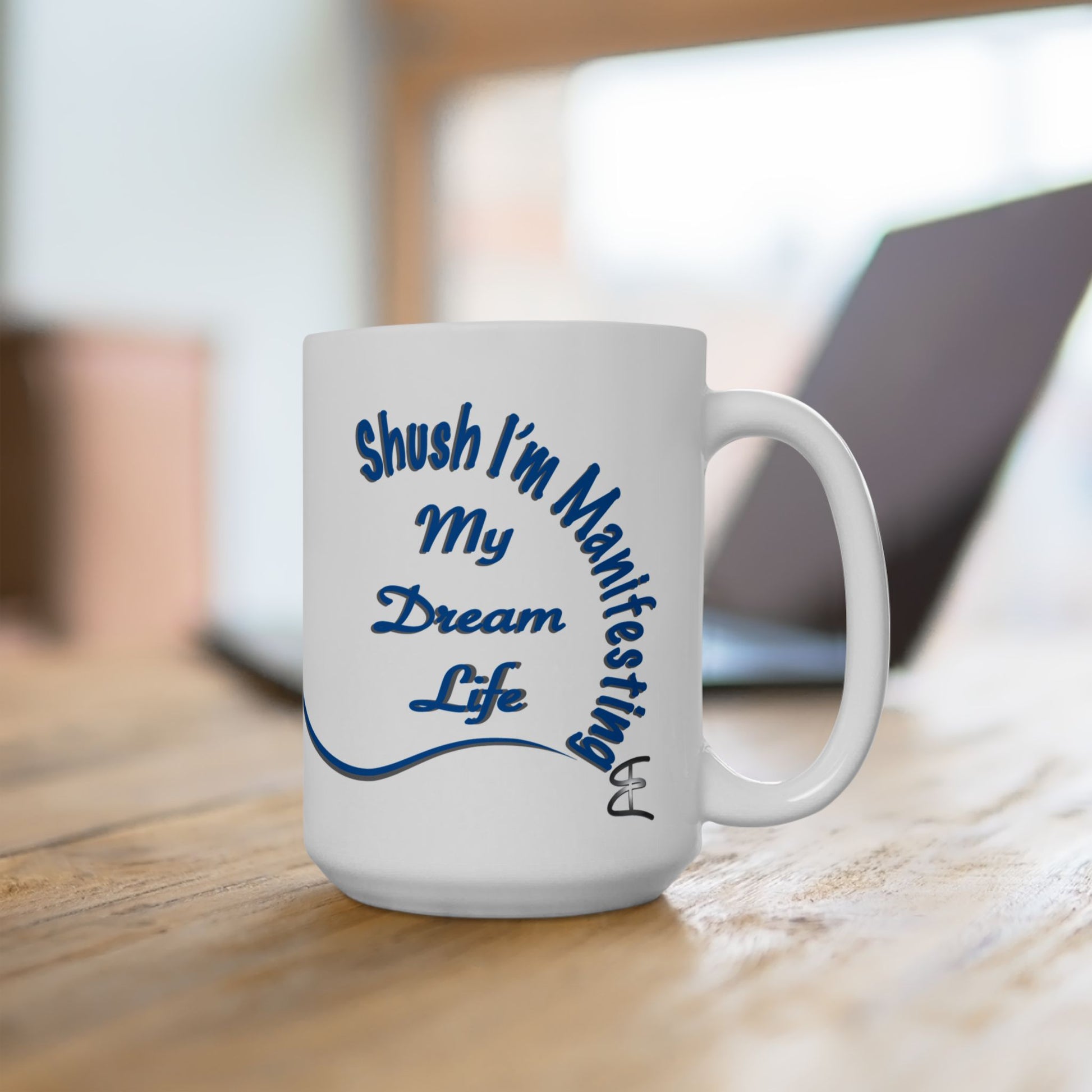 White ceramic mug with the text 'Shush, I'm Manifesting My Dream Life'

